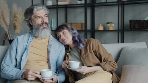 Mature Couple Relaxing Indoors on the Couch