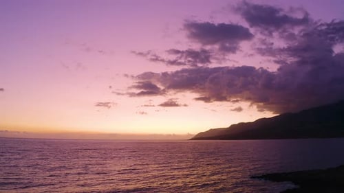 Aerial drone view of beautiful Sunset in Greece. Flying back above Sea at Dusk.