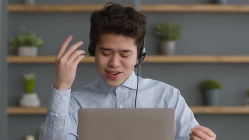 Young Adult Man On Video Conference Call At Home