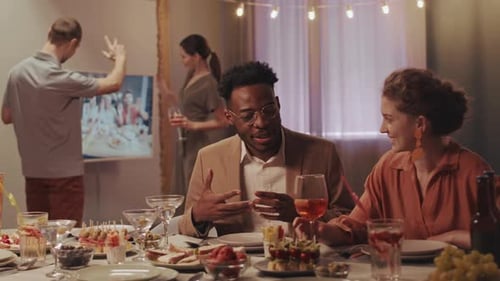 Friends Gathering for Birthday Celebration, Indoor Setting