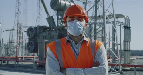 Confident Worker in Mask on Power Station