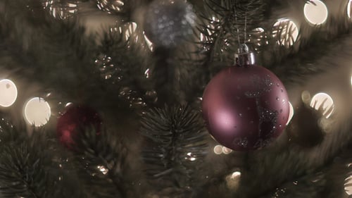 Decorating Christmas Tree with Ornaments in Cozy Home