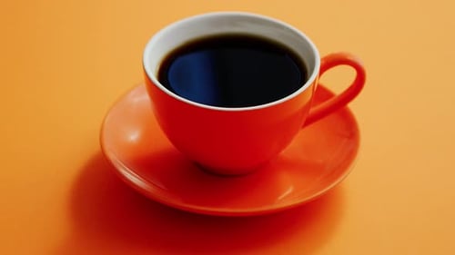 Orange Coffee Cup on Orange Background