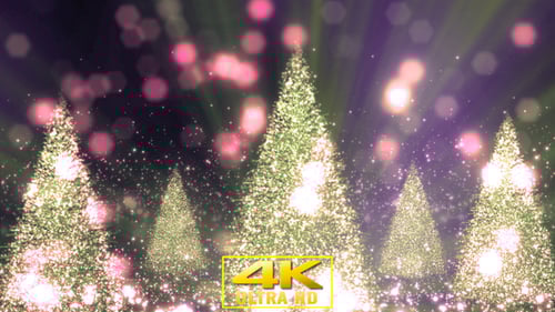 Glimmering Particles Falling Around Festive Christmas Trees