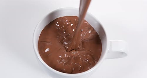 Chocolate Pouring into a Bowl, Slow Motion 4K