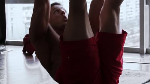 Man Doing Crunches for an Ab Workout at Home