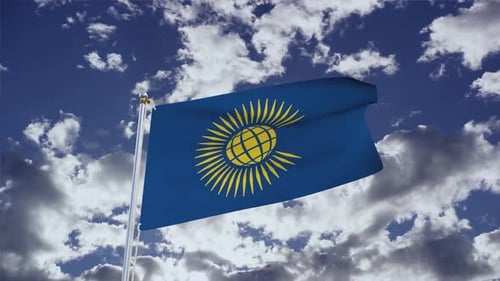Waving Commonwealth Flag Animation Against Blue Sky