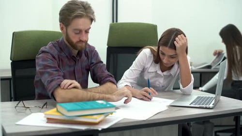 Tired Office Workers Discuss Sales and Develop Plans for the Future