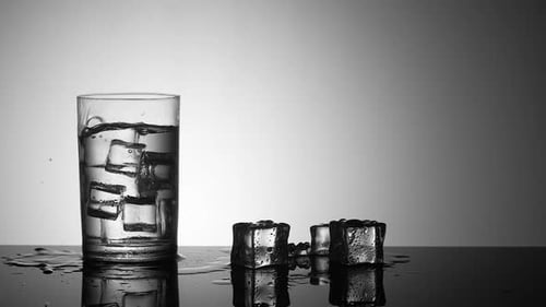 Ice Cube Splashes in a Glass of Water