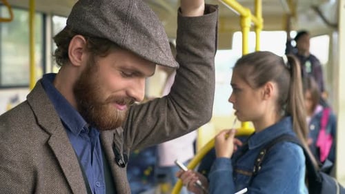 People Riding Bus Using Mobile Devices