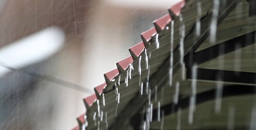 Rain Falling on Decorative Roof in the City