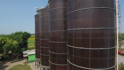 Grain Silo And Farmland Landscape