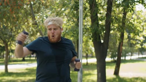 Overweight Man Doing Fat Burning Workout in Park