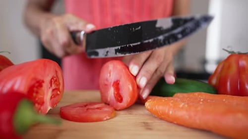 Slicing Fresh Tomatoes for Healthy Cooking Preparation