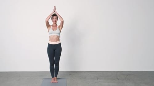 Athletic Woman Doing Yoga on Mat