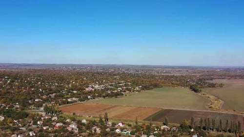 Scenic Aerial View of a Rural Town and Fields