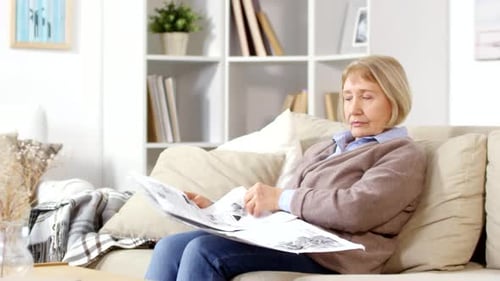Old Woman Reading Newspaper