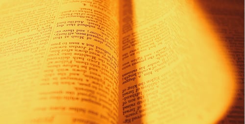 Open Bible Book with Religious Text Close Up