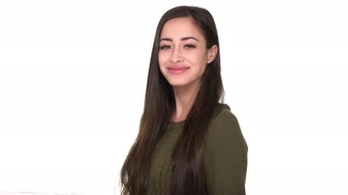 Smiling Woman Gives Thumbs Up on White Background