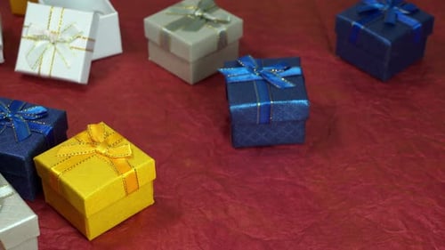 Gift boxes with red heart on festive background