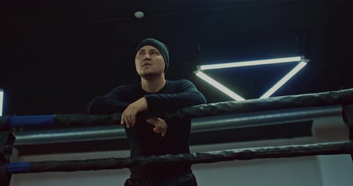 Confident Fighter in Training Hall of Fight Club Portrait Near Fighting Ring Prores