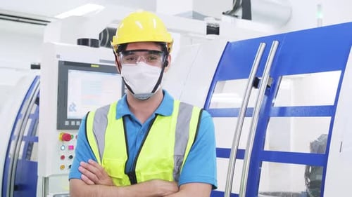 Caucasian worker people wearing protective face mask in production factory and smile, look at camera