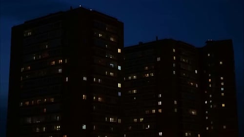 Close Up View To Windows in Apartment Buildings at Night,
