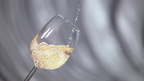 Pouring champagne in a glass
