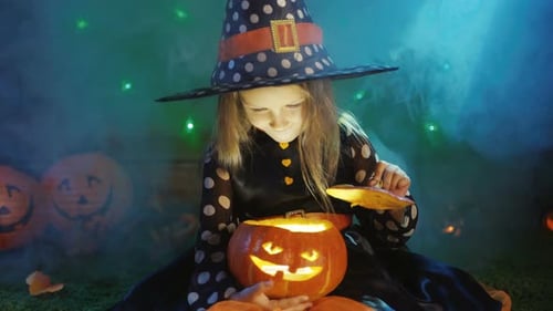 Girl Opens Jack-o-Lantern on Halloween Night
