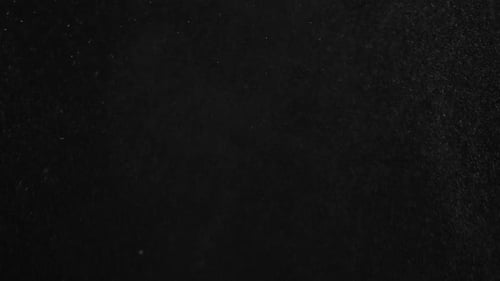 Abstract White Particles Floating on Black Background