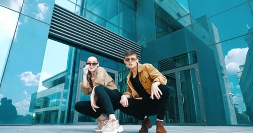 Trendy Young Adults Dancing Together in a City