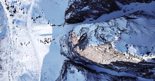 Aerial View of Snowy Mountains in Winter