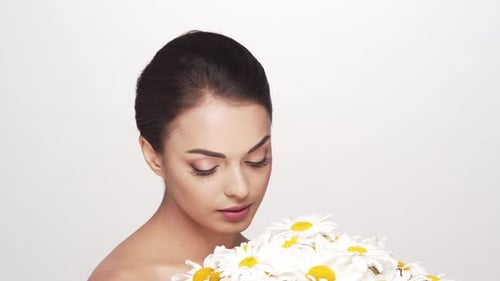 Studio portrait of young and beautiful brunette woman over