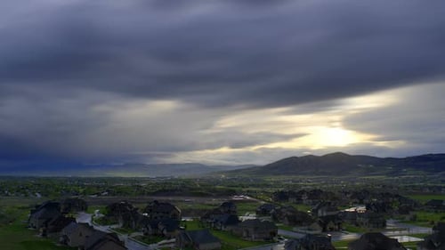 Time-lapse of heavily clouded sunset over Utah valley.