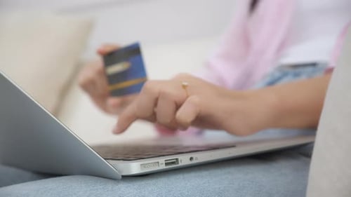 Woman Shopping Online with Laptop and Card