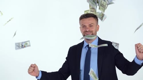 Man in Suit Celebrates with Falling Money