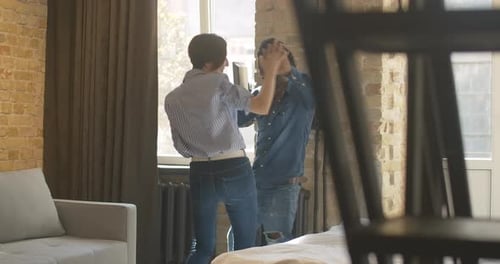 Couple Dancing Together in an Apartment
