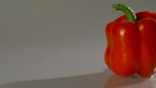 Vibrant Red Pepper with Water Droplets
