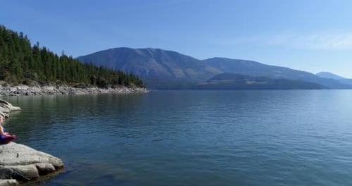 Woman Performing Yoga on At Lake Shore 4k