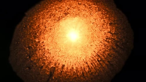 Expanding Fiery Light on Black Background