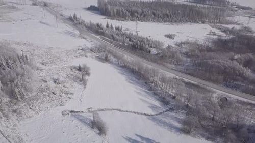 White frozen and snowy winter landscape from bird eye