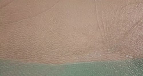 Beautiful beach with sea transparent clean water on both sides. Island concept travel destination.