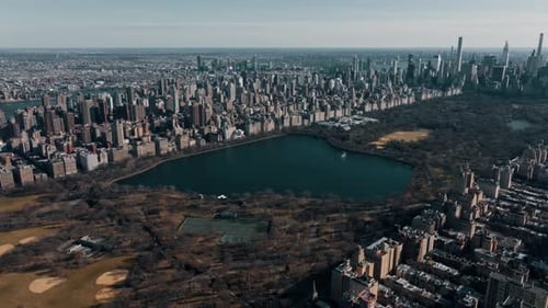 Aerial Drone Flight Above Green Central Park in Manhattan