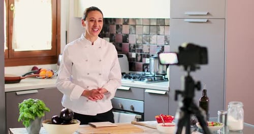 Woman Chef Recording Cooking Tutorial in Kitchen