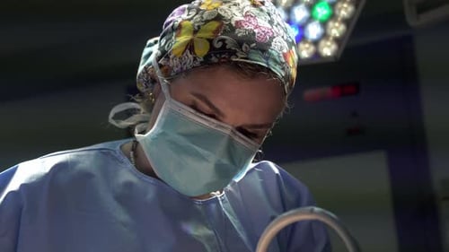 Female surgeon working in operating theater