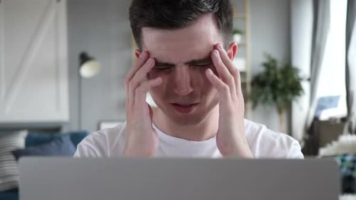Headache Close Up of Tense Man Working on Laptop