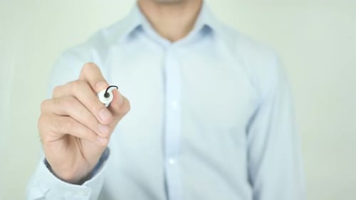 Hand Writes Counseling with Marker on Clear Surface