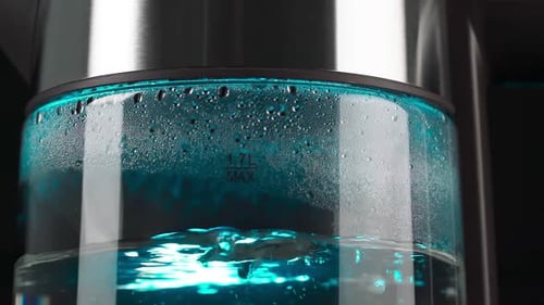 Water Boiling in an Electric Kettle with Blue Light