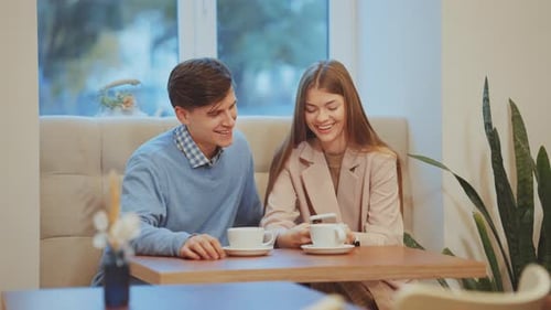 Romantic Couple Having Date in Cafe