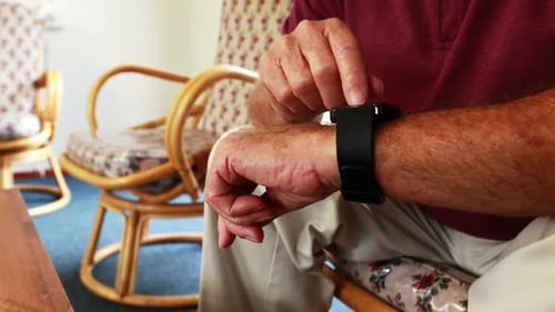 Retired person is using smart watch